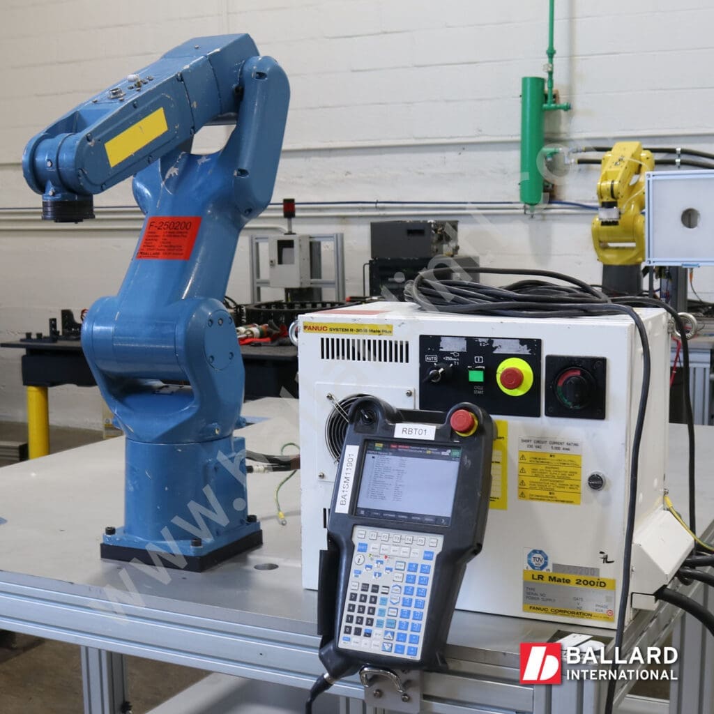 FANUC LR Mate 200iD/7L with R30iB Mate Plus Controller side angle view with teach pendant display under power